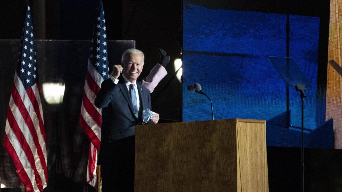 Joe Biden, 2020 Democratic presidential nominee, gestures towards supporters during an election night party in Wilmingt