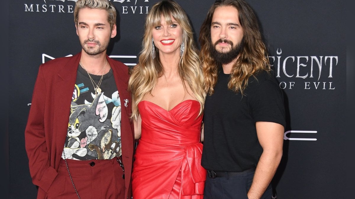 Die Brüder Bill (l.) und Tom Kaulitz mit Heidi Klum.. © Birdie Thompson/AdMedia/ImageCollect