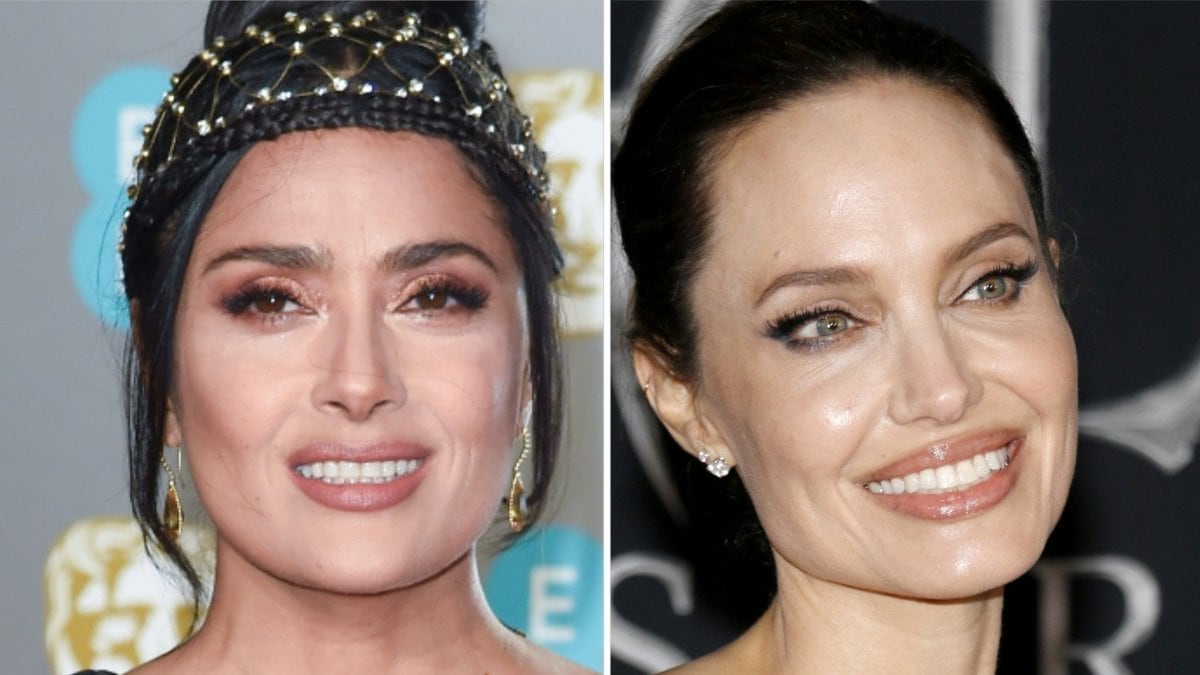 Salma Hayek (li.) versteht sich blendend mit Angelina Jolie.. © Featureflash Photo Agency/Shutterstock.com / Tinseltown/Shutterstock.com